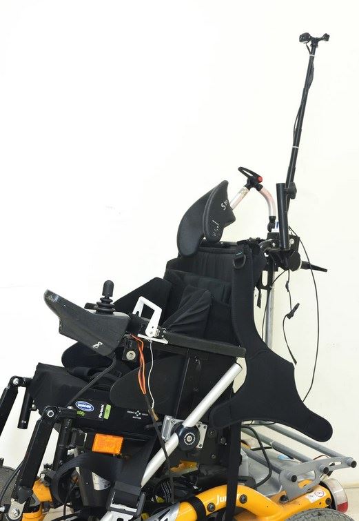 Impact alert system for powered wheelchair training
