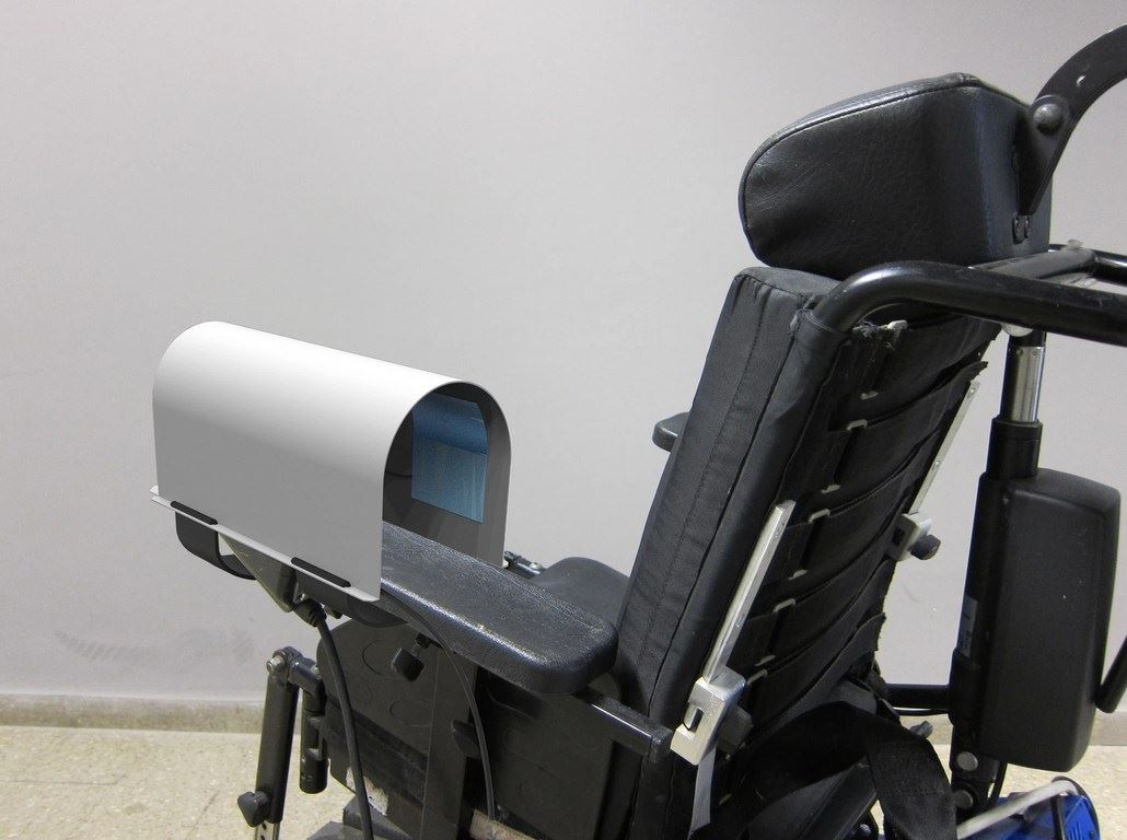 Hand-warming device for a hand operating the wheelchair